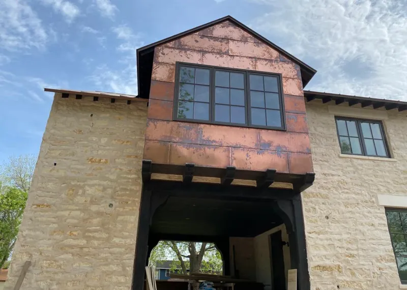 Copper metal panel facade on a stone building for Metal Roof Coating in Umatilla