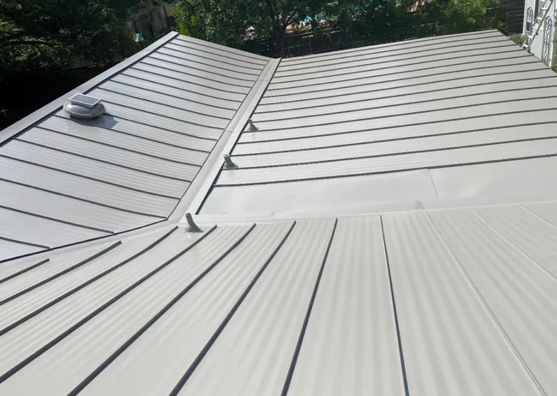 Solar attic fan installed on a metal roof for Roof Ventilation in Umatilla