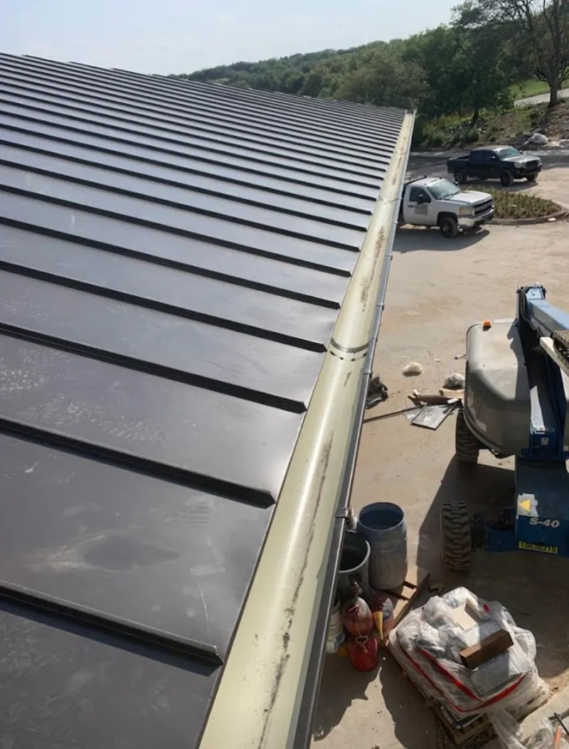Standing seam panel and gutter detail on a metal roofing jobsite in Umatilla